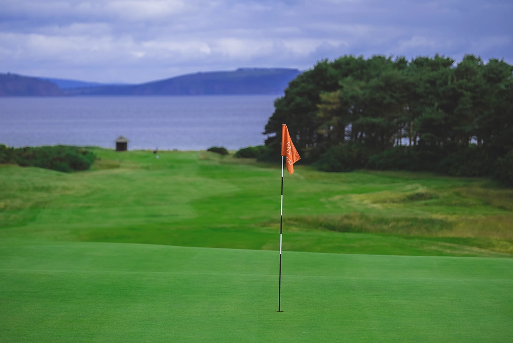 Nairn 13th green and fairway looking back to Moray Firth