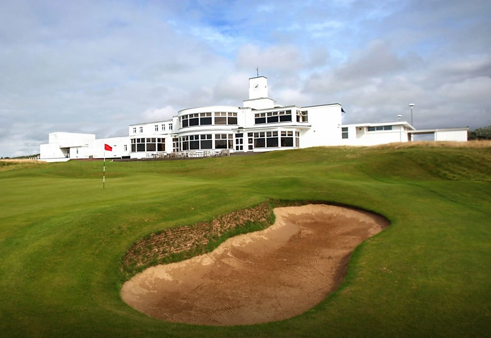 The white stone art deco clubhouse at Birkdale overlooking the 18th green
