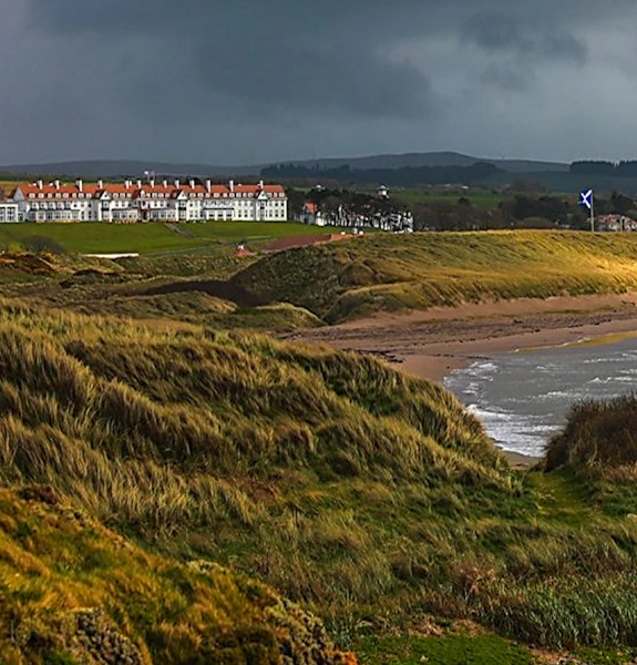 looking over the barrier dune towards the Turnberry hotel on the hill in the distance