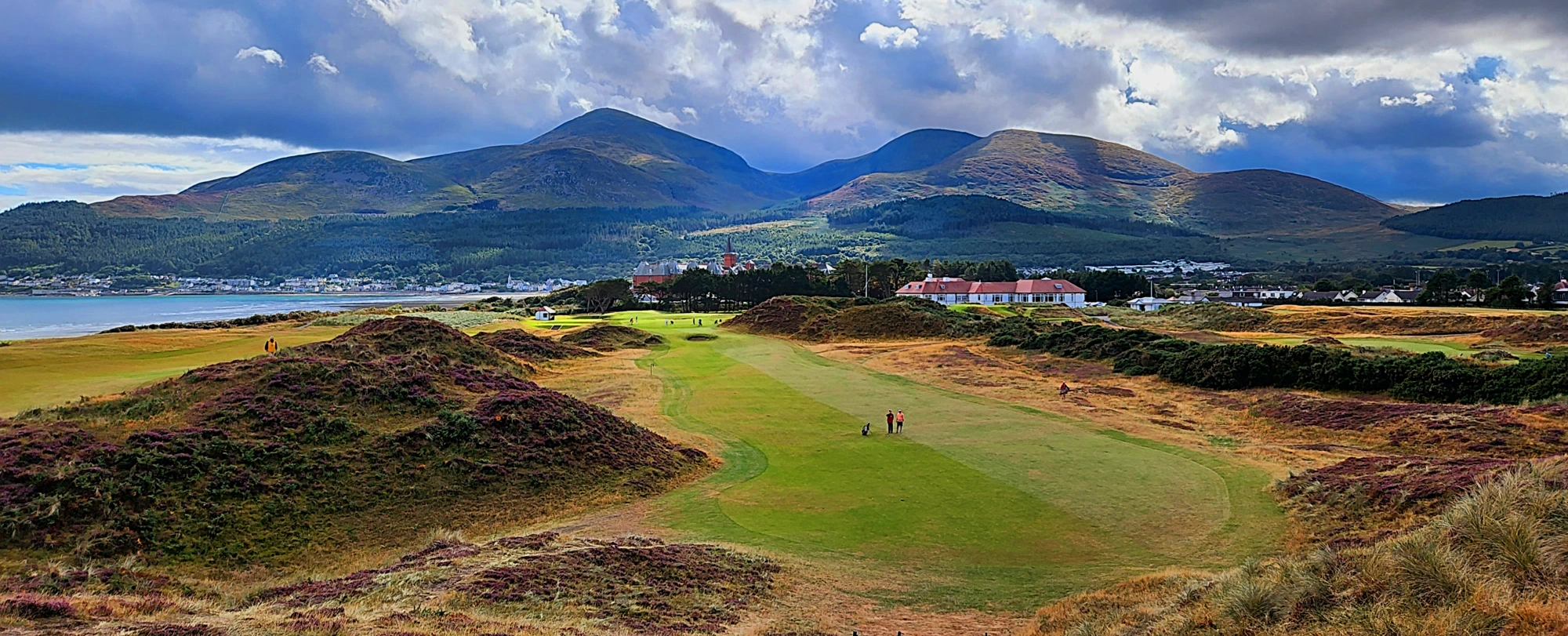 Panorama of Royal County Donard with the mountain of Slieve Donard overlooking the course