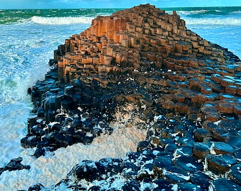 Giants Causeway with foaming sea
