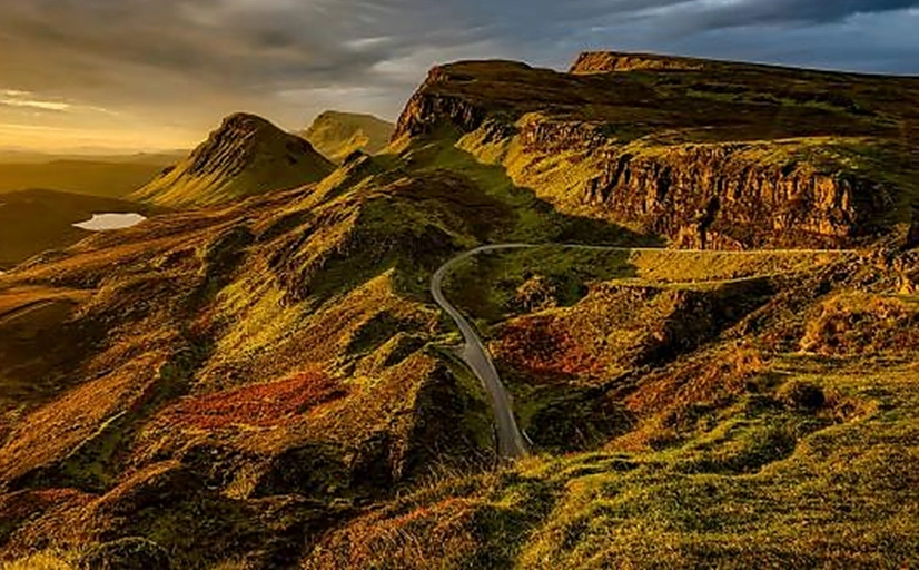 Winding road in the Quinraing on the Isle of Skye through post volcanic landscape