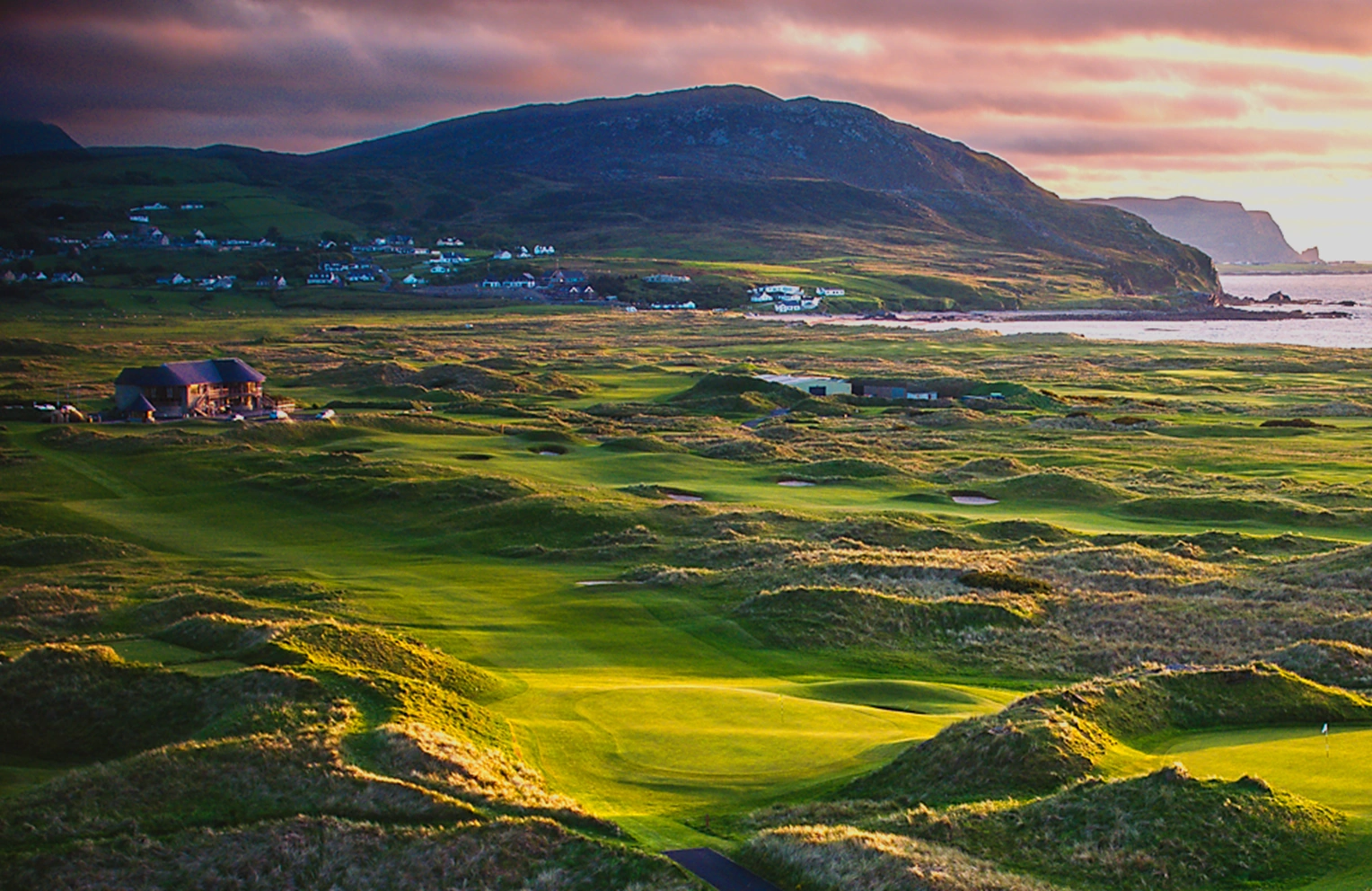 Aerial view of the 1st green and fairway at Ballyliffin with mountain in background