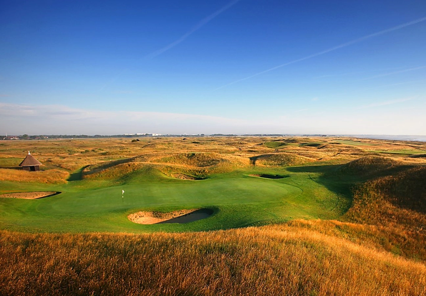 Royal St Georges golf course looking down onto the green with dunes tumbling away in the background to the horizon