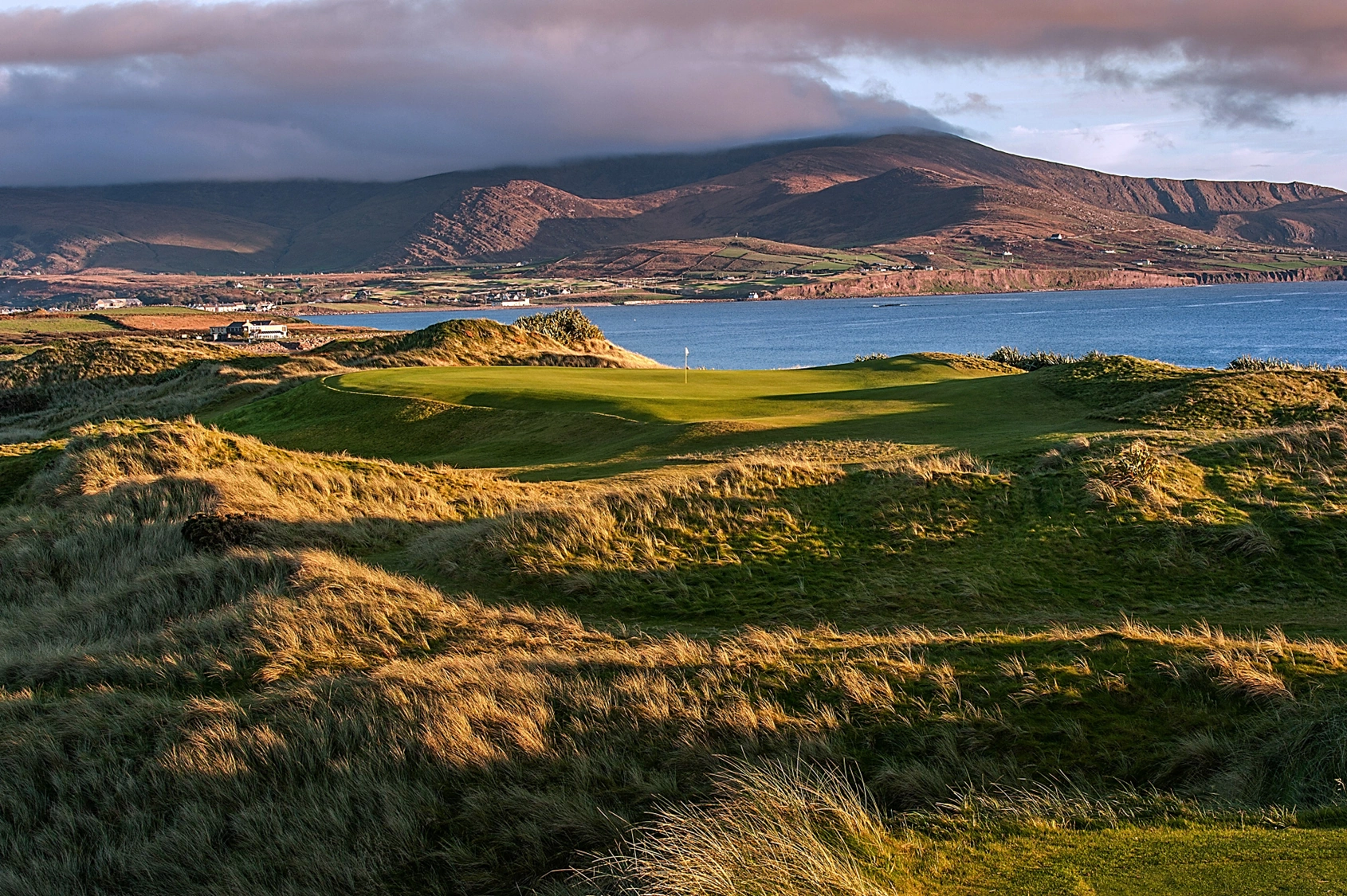 17th green at Waterville with sea and mountains