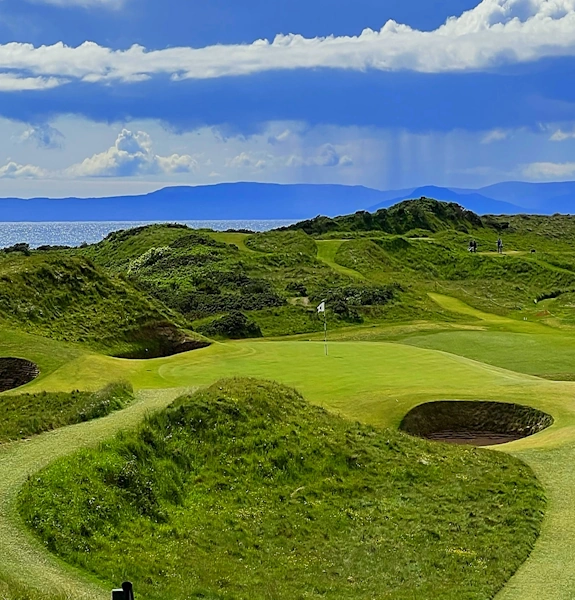 The postage stamp at Troon with the Isle of Arran behind