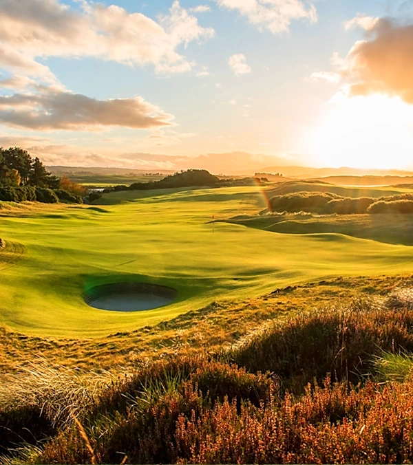 The 5th hole at Castle Stuart in the summer with a sunburst