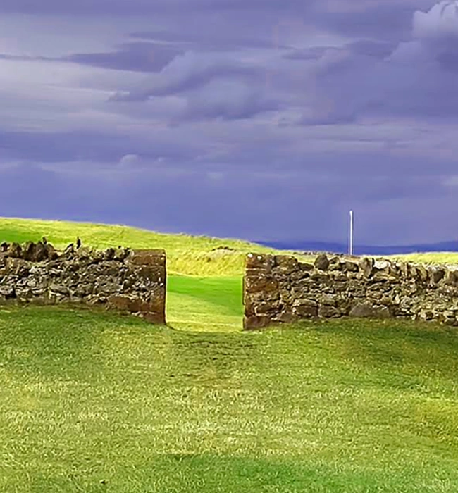 Gap in the stonewall at the 13th at North Berwick